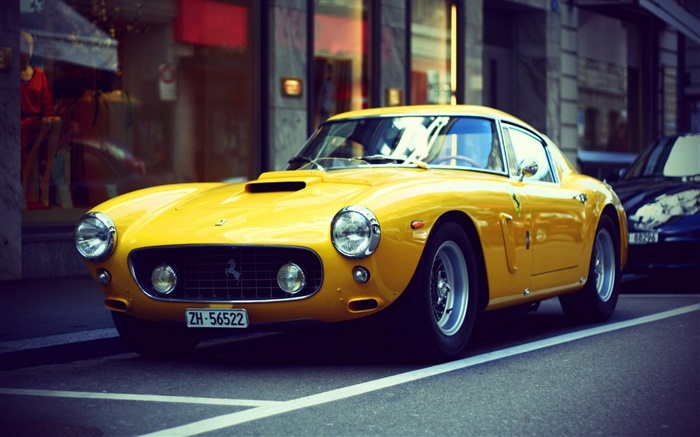 Ferrari coche retro de color amarillo en la calle Fondos de pantalla, imagen