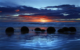 Cantos rodados de Moeraki, Koekohe Playa, mar, puesta del sol, Isla Sur, Nueva Zelanda HD fondos de pantalla