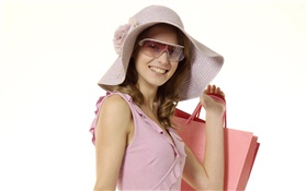 Feliz compra niña, vestido rosa, sombrero, gafas de sol