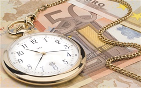 Reloj y la moneda Euro