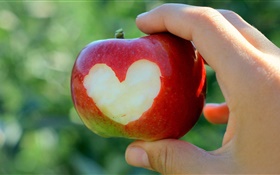 manzana roja, corazones del amor, la mano