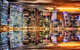 Hermosa noche de la ciudad, los rascacielos, las luces, la reflexión del agua HD fondos de pantalla