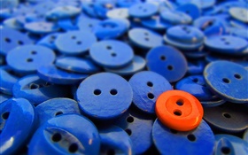 Muchos botones azules, uno rojo